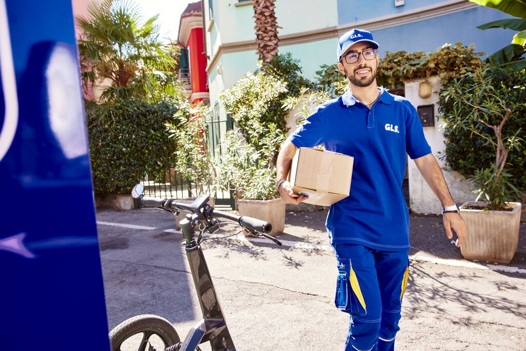 GLS team member dropping off package